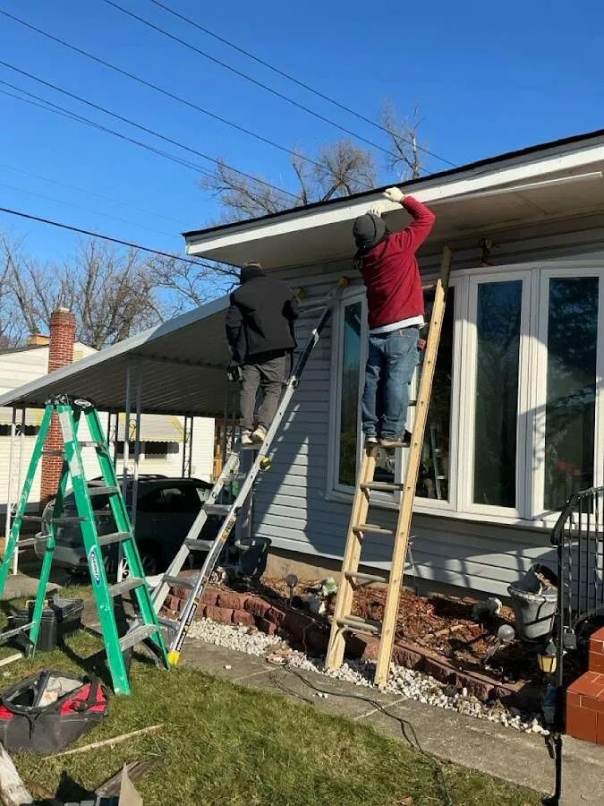 Restoration crew performing exterior repair in Schroeppel
